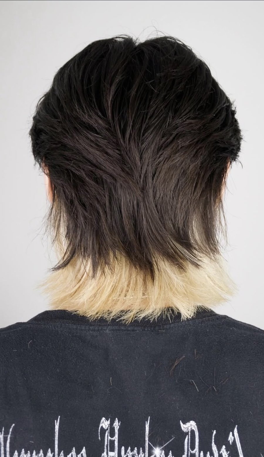 Two-tone mullet with a blonde underside at fyf North