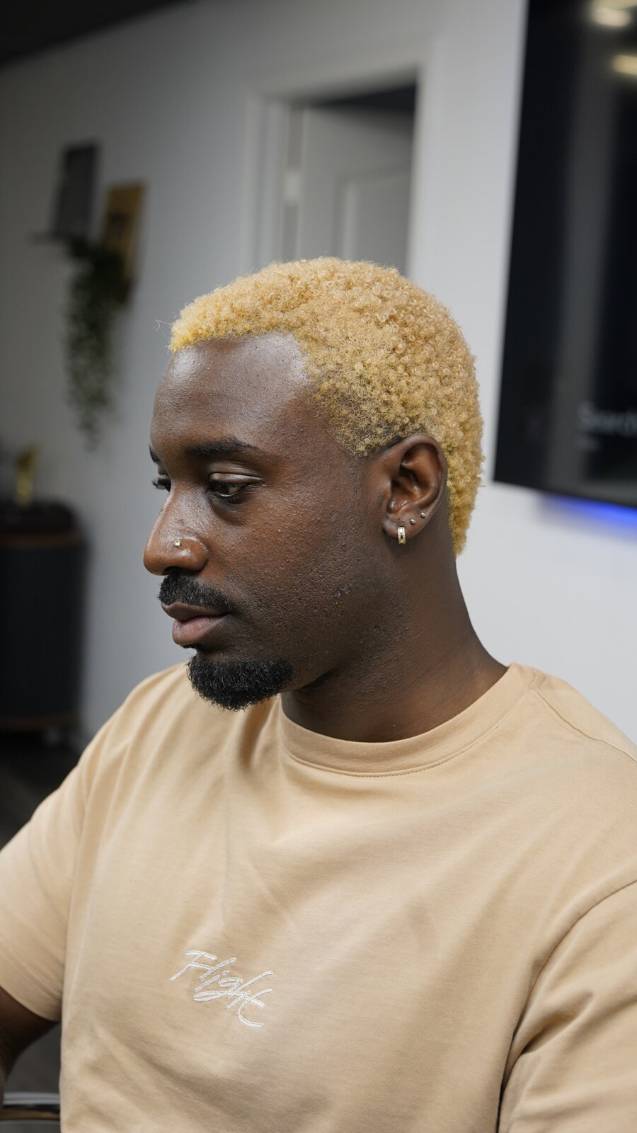 Client with a platinum blonde buzz cut at fyf North